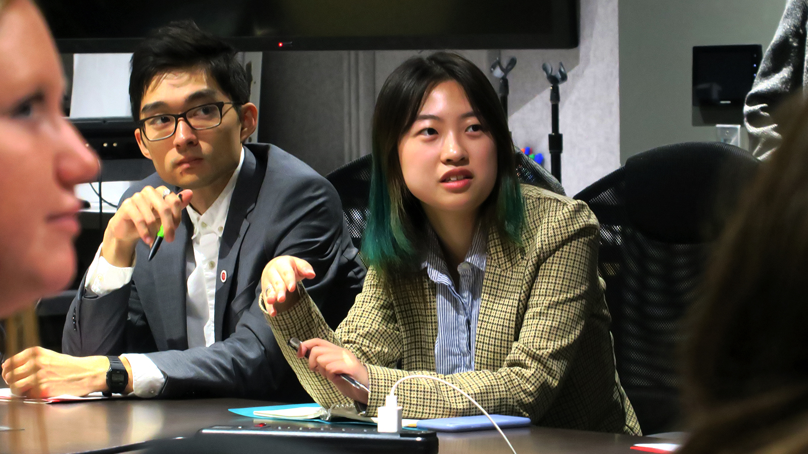 Two students listen to an employer during a Career Trek to NYC