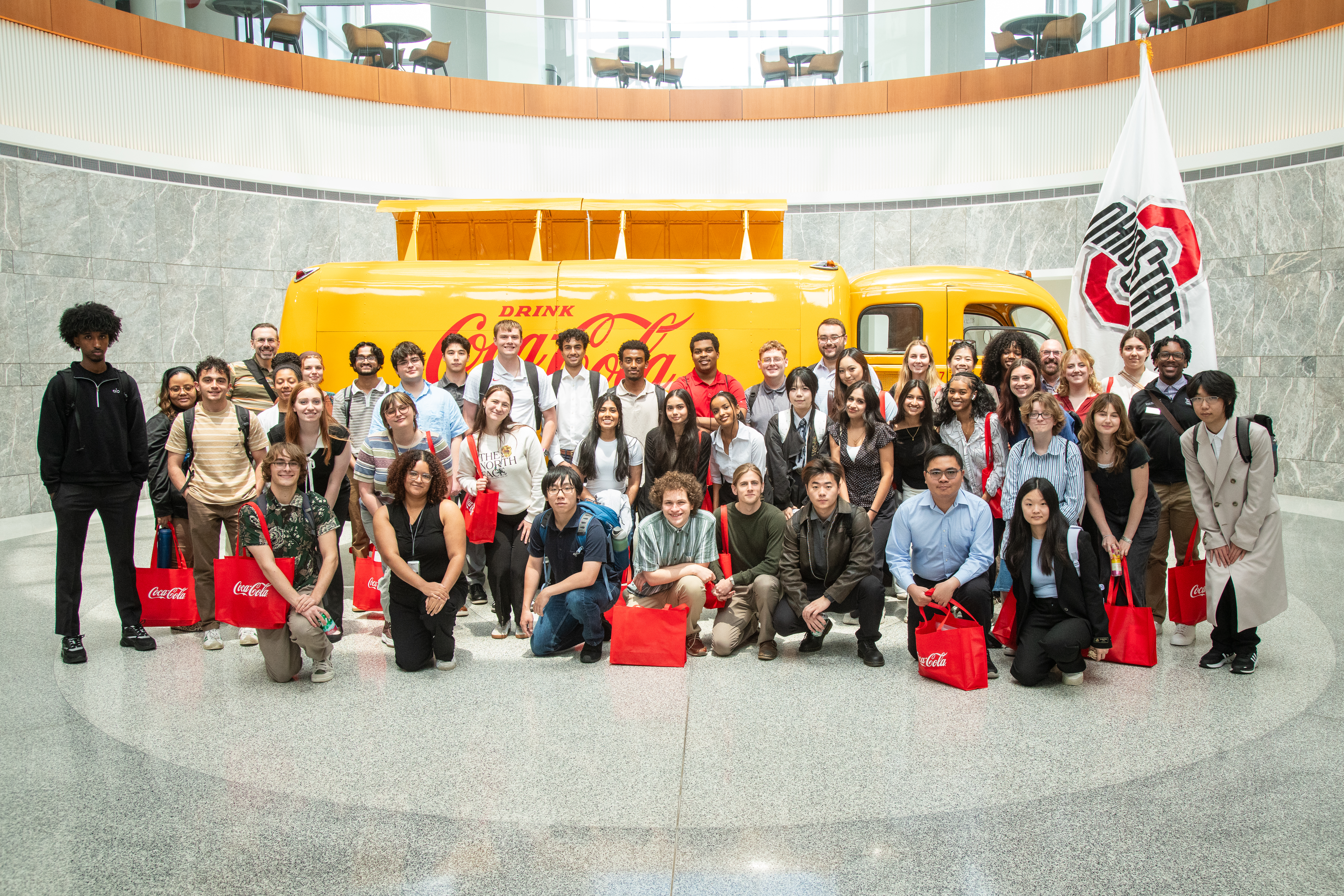 Students standing in front of the yellow Coca Cola truck at their Atlanta HQ.