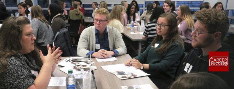 Students listen to a guest speaker at a Life Beyond Degree event.