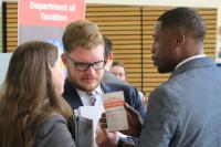 ASC Student talks with recruiters at a career event