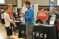 A student talks to a representative from Medpace at the 2019 Science Career Fair