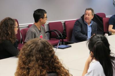 Students listen to Spectrum CEO during a Coffee Chat
