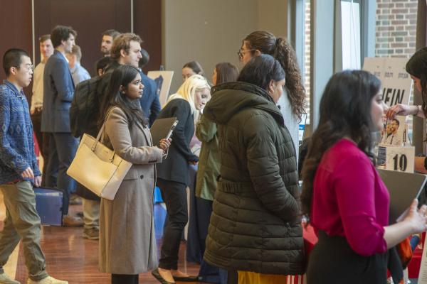 Students gathering in line at a career fair.