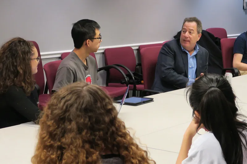 Students listen to Spectrum CEO during a Coffee Chat