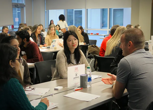 A student talks with an alumni at a Life Beyond Degree event