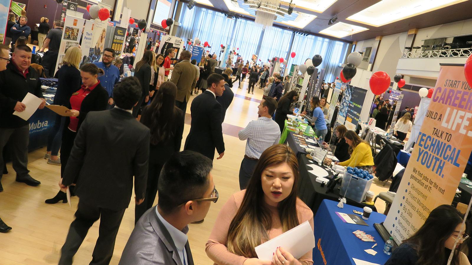 A crowded aisle during the Spring Career Fair